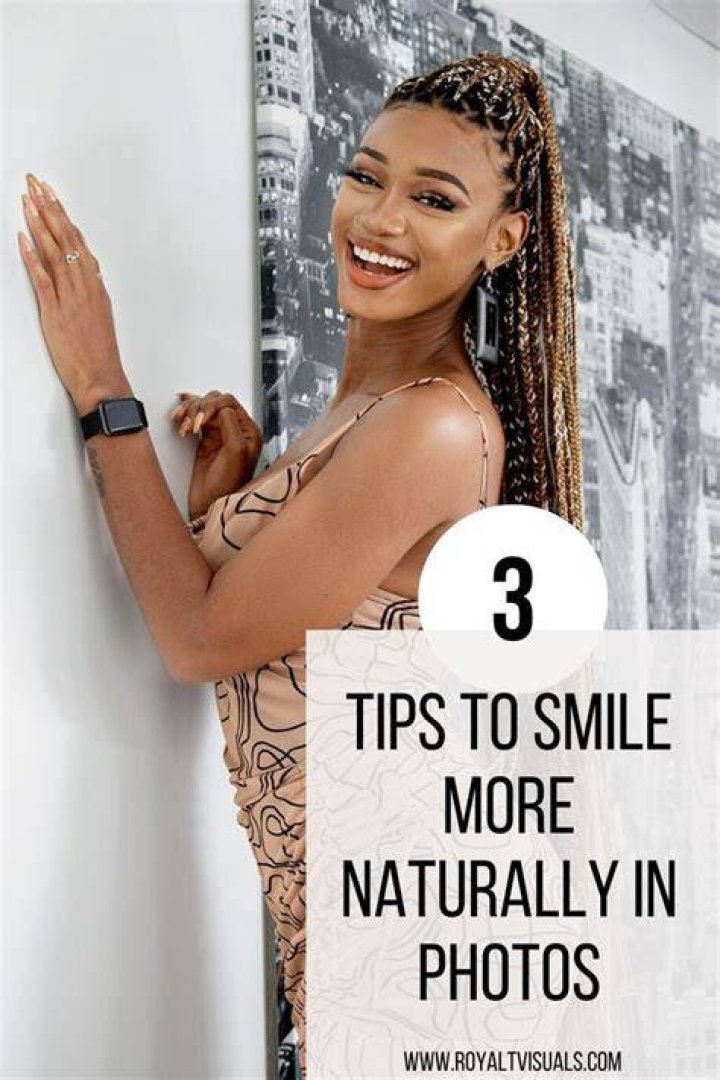 How can I naturally smile for pictures?