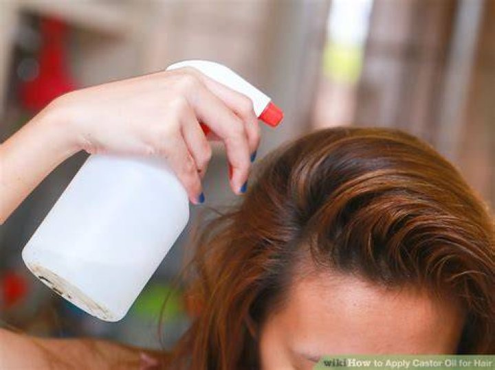 How do you apply castor oil to hair?