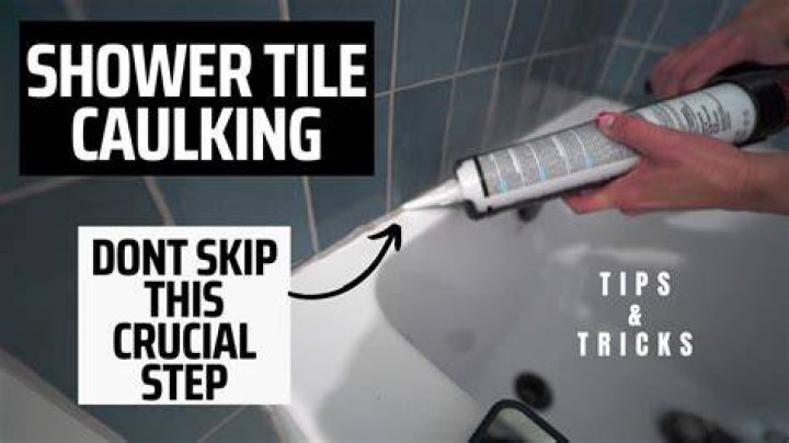 Should you caulk between tile and shower pan?