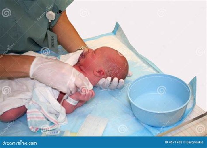 When should a newborn have his first bath?