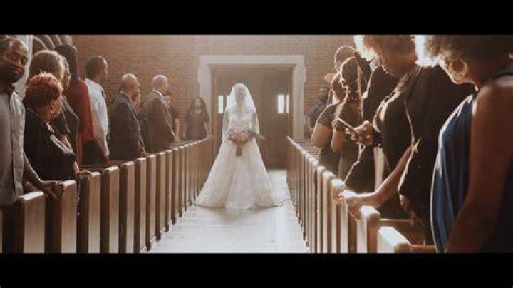Who walks the bride's mother down the aisle?